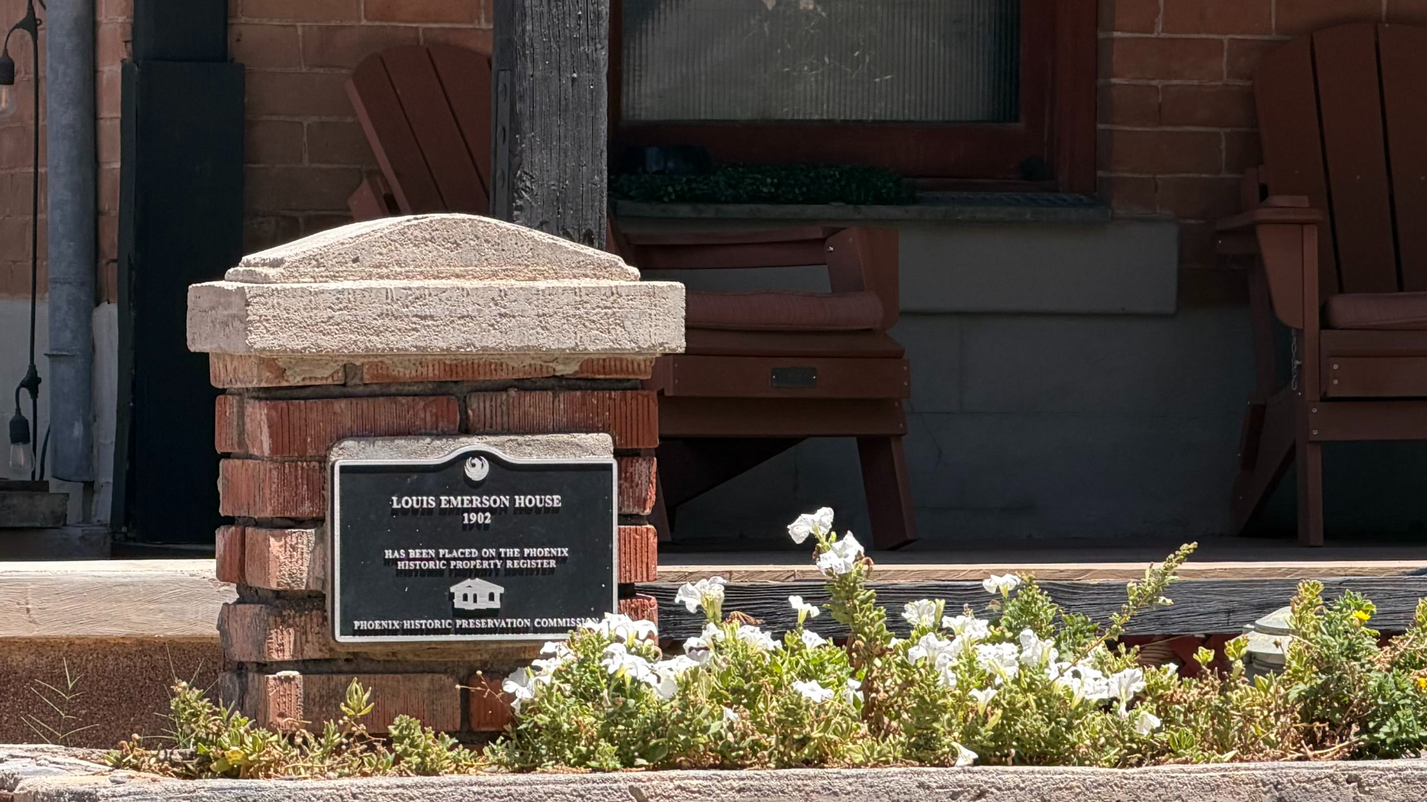 The Phoenix Historic Property Register plaque mounted on the brick column of the Louis Emerson House, reading LOUIS EMERSON HOUSE 1902